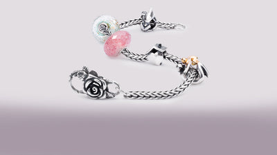 Trollbeads bracelet with Rose Lock, Maternity Dolphin Spacer, Strawberry Quartz, Meditation, Home